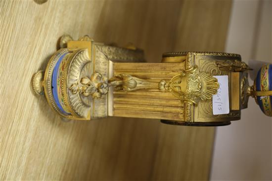 A 19th century French ormolu and porcelain clock garniture